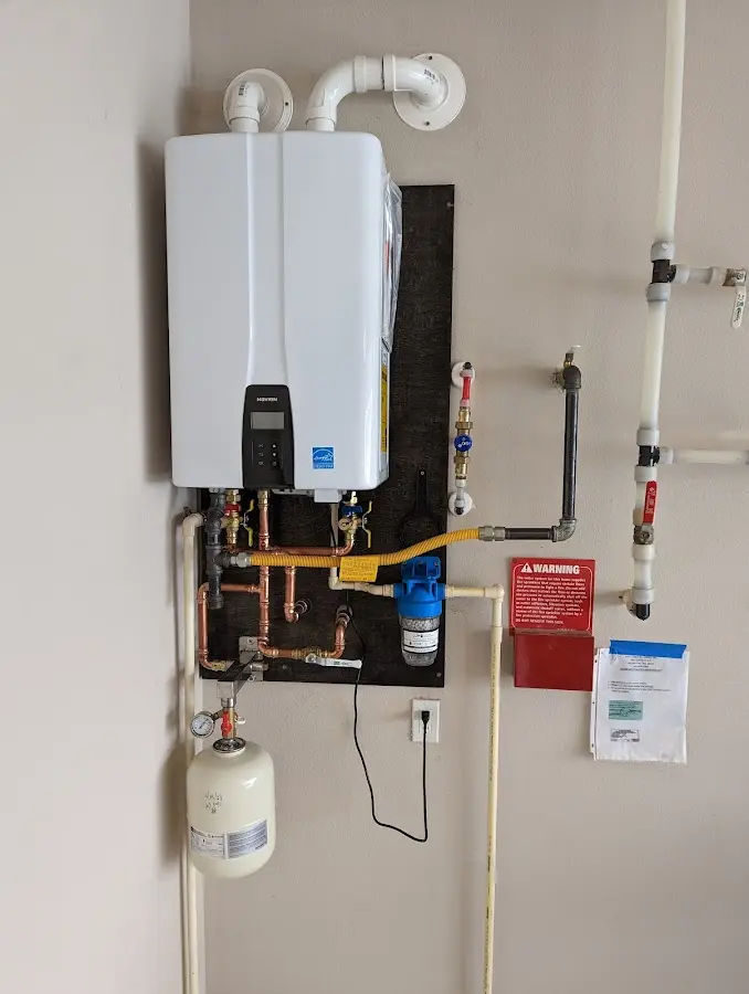 Professional plumber installing copper piping in a Fortuna Foothills home